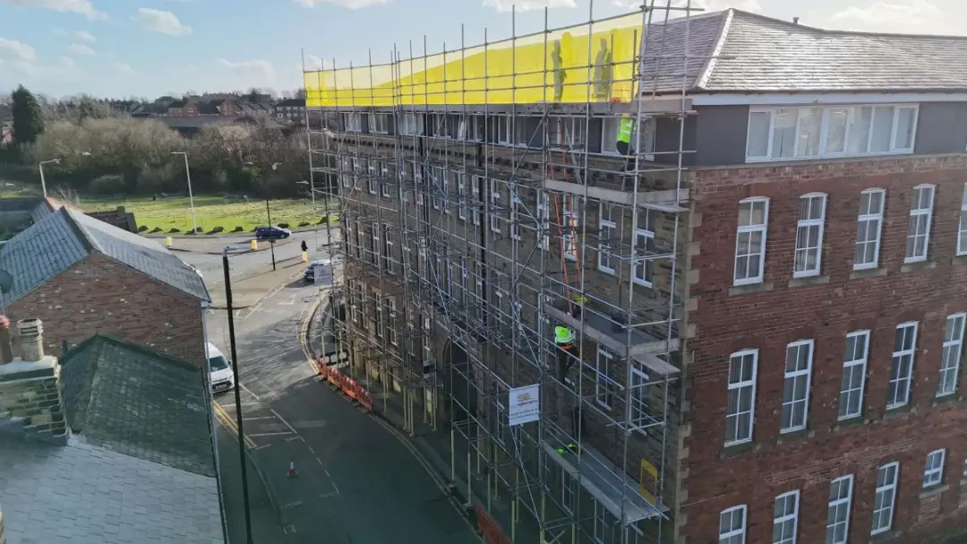 Scaffold on a stone mill building