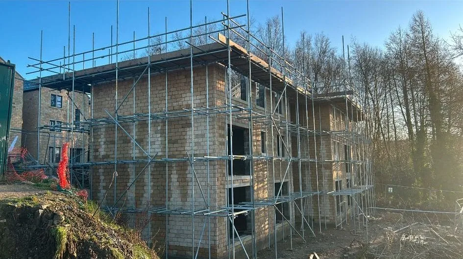 New-build blockwork wrapped in scaffold