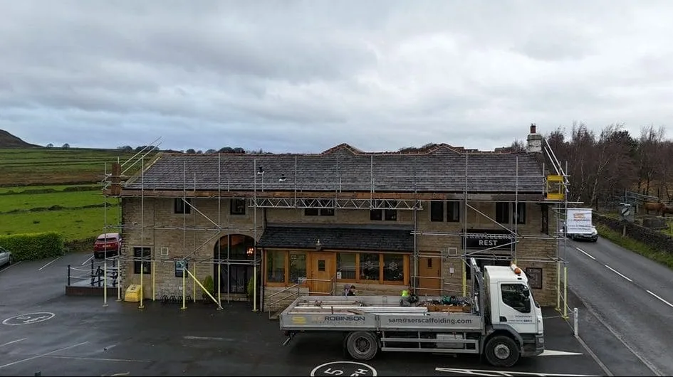Scaffold on a moorland building with our lorry on site