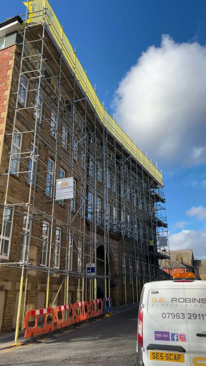 Scaffold Hire Huddersfield - the S.E. Robinson van below a scaffolded mill